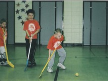 Ethan playing floor hockey